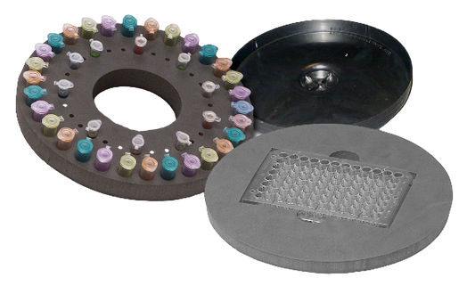 Round plastic tray with colorful beads and a black lid on a white background