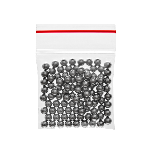 Clear plastic bag filled with small metallic balls on a white background