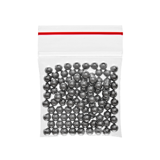 Clear plastic bag filled with small metallic balls on a white background