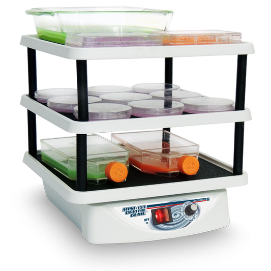 Three-tiered incubator with various containers on a white background