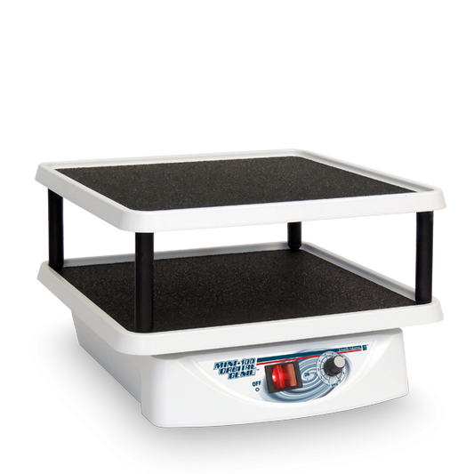 Small white and black machine with a control panel on a white background