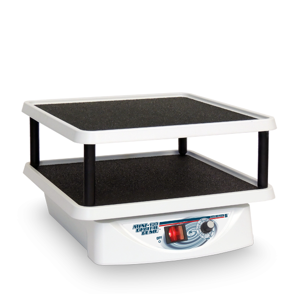 Small white and black machine with a control panel on a white background