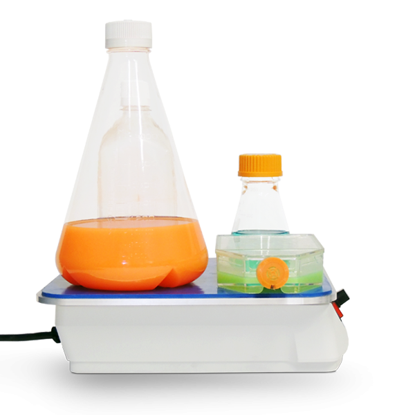 Bottle top sealing machine with bottles on a white background