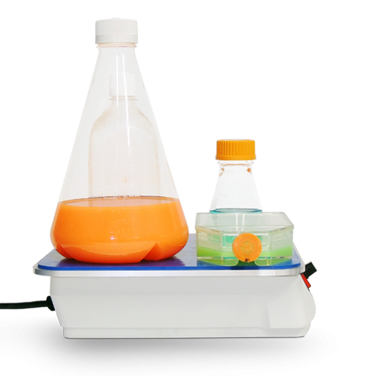 Bottle top sealing machine with bottles on a white background