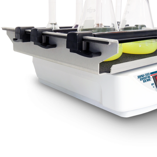 Close-up of a tennis ball holder with a tennis ball inside, on a white background.